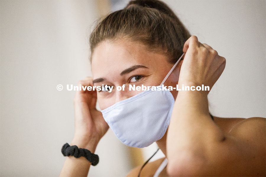 Olivia Boldt, senior from Madison, South Dakota, puts on her mask before going to work out. First day of Campus Recreation re-opening after being shut down due to COVID-19 concerns. June 15, 2020. Photo by Craig Chandler / University Communication.