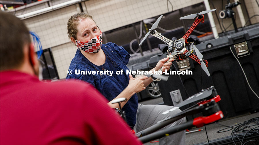 Brittany Duncan, assistant professor of Computer Science and Engineering, discusses drone equipment in the Nimbus Lab. Brittany is wearing a mask for protection from the COVID-19 pandemic. June 23, 2020. Photo by Craig Chandler / University Communication.