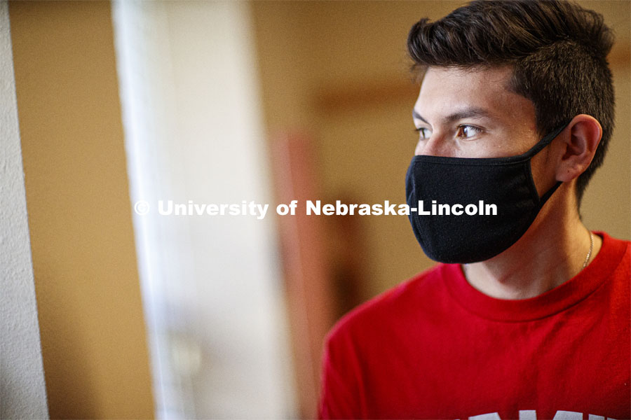 Edwin Mendez-Rodriguez in a University Suites Residence Hall room. Photo shoot of students wearing masks and practicing social distancing. June 24, 2020. Photo by Craig Chandler / University Communication.