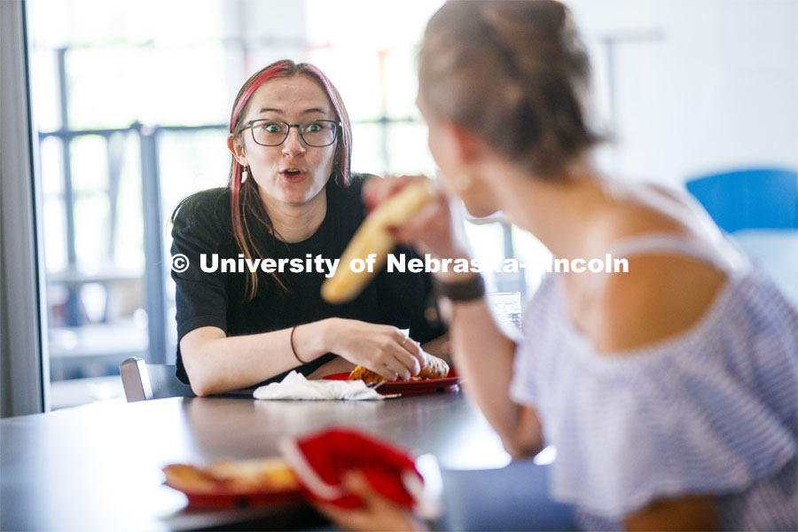 Students eating in the Willa Cather Dining Center. Photo shoot of students wearing masks and practicing social distancing in dining services in Willa Cather Dining Center. July 1, 2020. Photo by Craig Chandler / University Communication.