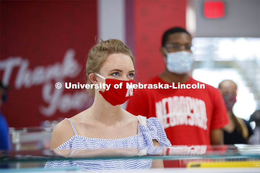 Students standing in line at the Willa Cather Dining Center wearing masks. Photo shoot of students wearing masks and practicing social distancing in dining services in Willa Cather Dining Center. July 1, 2020. Photo by Craig Chandler / University Communication.