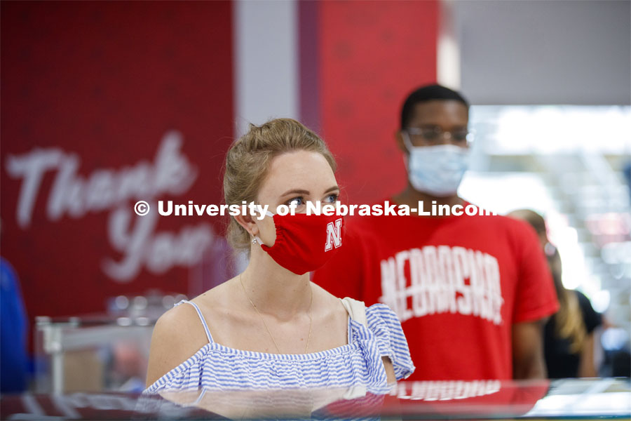 Students standing in line at the Willa Cather Dining Center wearing masks. Photo shoot of students wearing masks and practicing social distancing in dining services in Willa Cather Dining Center. July 1, 2020. Photo by Craig Chandler / University Communication.