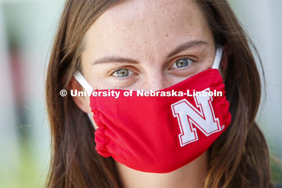 Anna Sambol, a Senior in Nutritional Science and Dietetics wears a Husker mask. Photo shoot of students wearing masks and practicing social distancing in dining services in Willa Cather Dining Center. July 1, 2020. Photo by Craig Chandler / University Communication.