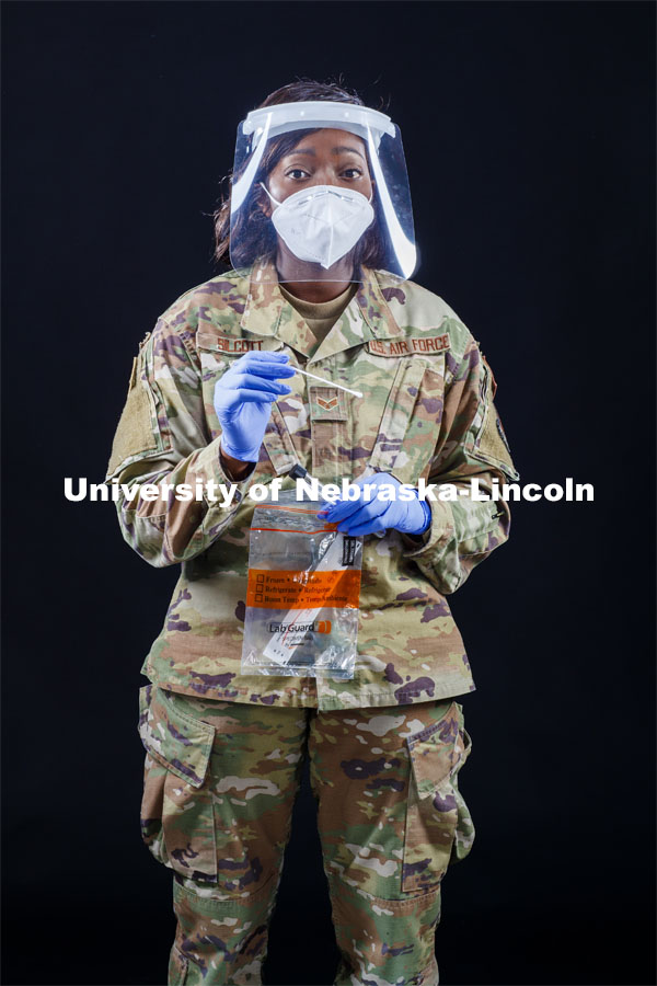 Senior Airman Tamara Silcott of the Nebraska Air National Guard wears a face shield made at Nebraska Innovation Campus. She wore the face shields along with other National Guard troops while testing thousands of Nebraskans for COVID this summer. Photo for the 2019-2020 Report Representing Nebraska’s Research Heroes. July 1, 2020. Photo by Craig Chandler / University Communication.