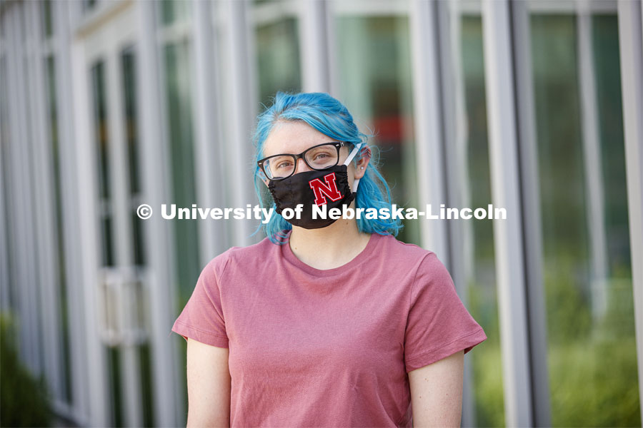 Atley Van Emmerik, a sophomore in dance from Glenvil, Nebraska wears a Husker mask. Photo shoot of students wearing masks and practicing social distancing in dining services in Willa Cather Dining Center. July 1, 2020. Photo by Craig Chandler / University Communication.