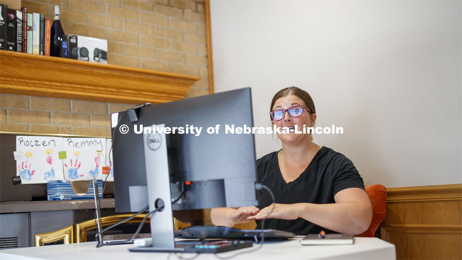 Kaitlin Ferris, New Student Enrollment and Academic Services and Enrollment Management advisor working out of her home. July 7, 2020. Photo by Craig Chandler / University Communication.