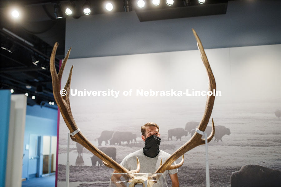 Zak Kathol wears a mask as he looks over exhibits in the Cherish Nebraska exhibition. Nebraska State Museum in Morrill Hall will open August 5 with new procedures to keep patrons healthy and safe. July 29, 2020. Photo by Craig Chandler / University Communication.