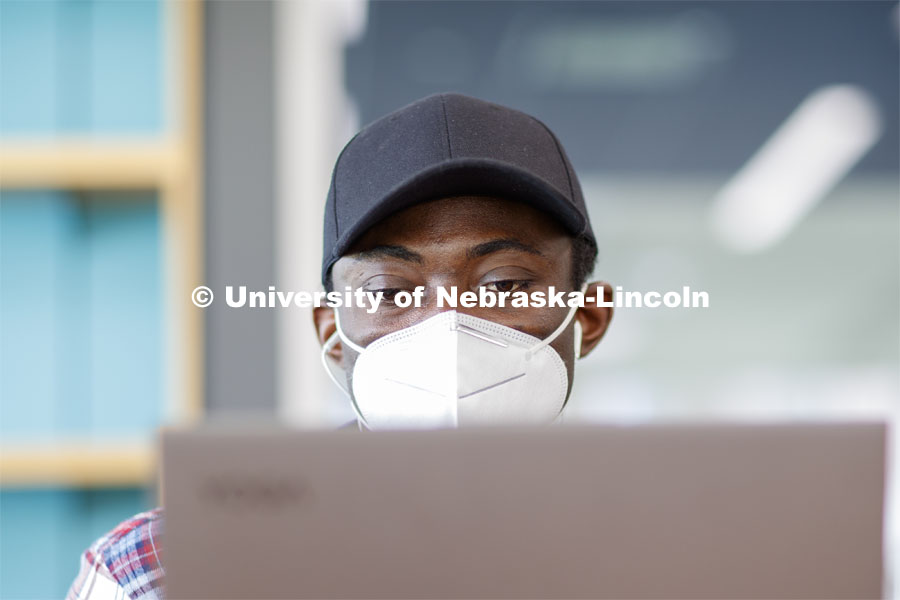Isaac Kyei, a graduate student in chemistry, studies in Love Library North. August 4, 2020. Photo by Craig Chandler / University Communication.