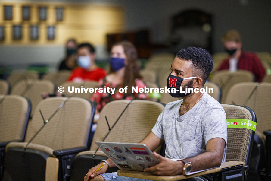 Masked students in an Anderson Hall Lecture Hall are seated for social distancing. Photo shoot of students wearing masks and practicing social distancing. August 11, 2020 Photo by Craig Chandler / University Communication.