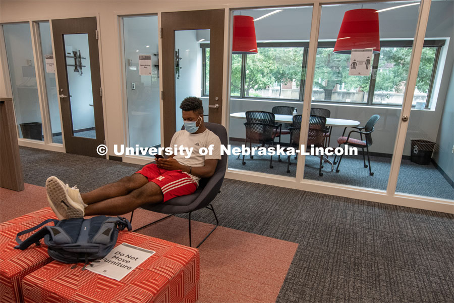Tedum Npimnee, a junior international business major, waits for an appointment in the new Husker Hub office in Canfield Administration Building. Previously located in Pound Hall, Husker Hub recently moved into its remodeled space. August 12, 2020. Photo by Gregory Nathan / University Communication.