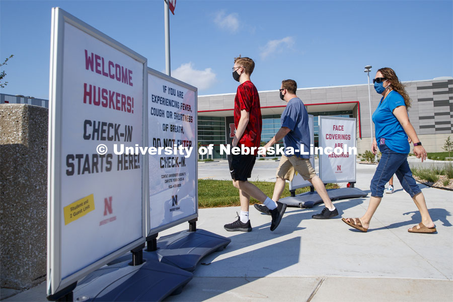 Students and family members head into Devaney Sports Center to begin their check in. First day of residence hall move in. August 13, 2020. Photo by Craig Chandler / University Communication.