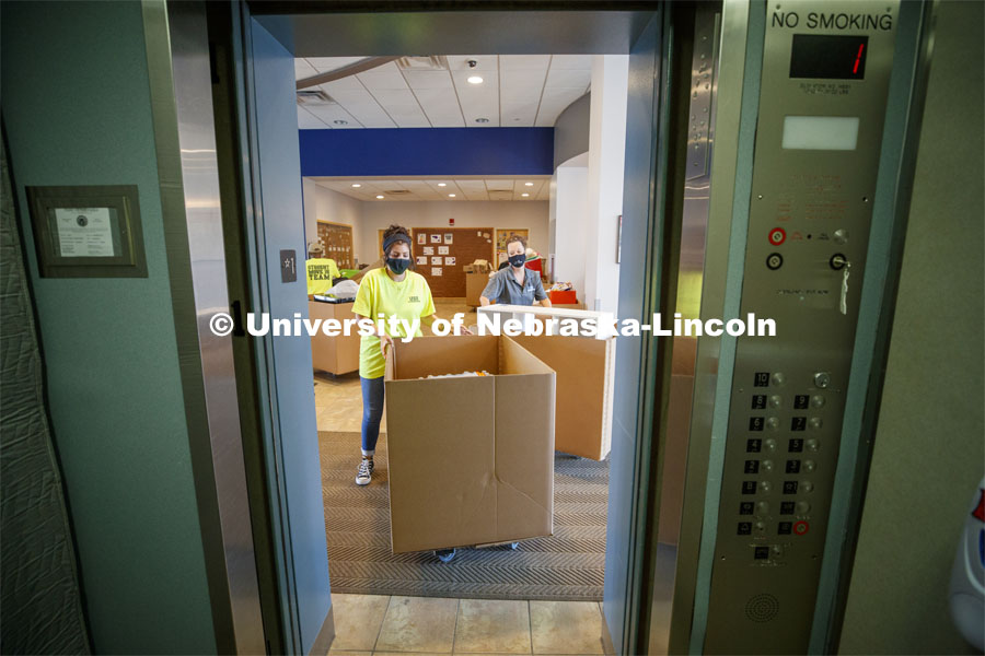 Students and family members used the stairs to avoid congestion in the lobby so the USS movers (University and Student Services) could take the student possessions to their rooms. First day of residence hall move in. August 13, 2020. Photo by Craig Chandler / University Communication.