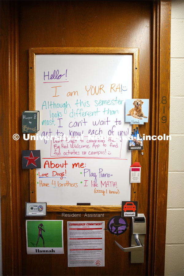 A first day welcome message adorns the door of the 8th floor Resident Assistant. First day of residence hall move in. August 13, 2020. Photo by Craig Chandler / University Communication.