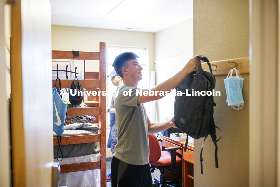 Jack Kinney of Omaha hangs up his backpack in his Knoll Residence Hall room. First day of residence hall move in. August 13, 2020. Photo by Craig Chandler / University Communication.