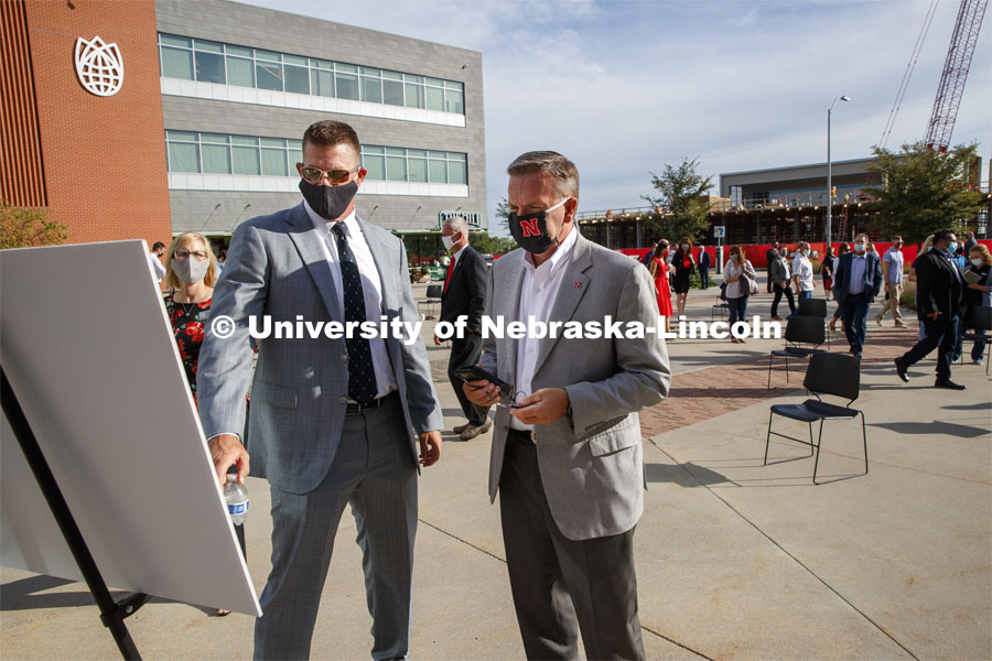 Zach Wiegert, principal of Goldenrod Companies and UNL Chancellor Ronnie Green look over renderings of the new hotel after the reveal. The Scarlet Hotel name was revealed today to announce the new hotel being built at Nebraska Innovation Campus. The hotel will be home to academic space managed by the University of Nebraska–Lincoln’s College of Education and Human Sciences and will house the Hospitality, Restaurant and Tourism Management program. August 18, 2020. Photo by Craig Chandler / University Communication.