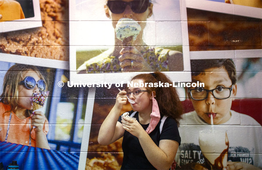 Caitlin Garcia of Papillion enjoys Dairy Store ice cream surrounded by other fans Thursday at the CASNR Launch. CASNR Launch for new students included a walking tour of East Campus with multiple stops to learn about majors, programs and points of interest like the Dairy Store. August 20, 2020. Photo by Craig Chandler / University Communication.
