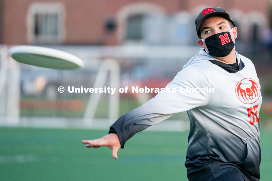 Senior Jacob Morrow throws a frisbee before the start of the HuskerMania Masker Singer event at Mabel Lee Fields. August 21, 2020. Photo by Jordan Opp for University Communication.