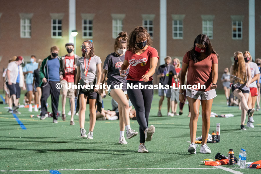 Students perform the Cupid Shuffle during the HuskerMania Masker Singer event at Mabel Lee Fields. August 21, 2020. Photo by Jordan Opp for University Communication.