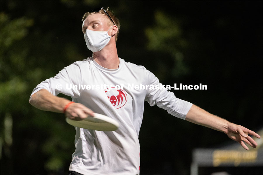 Senior Josh Adams throws a frisbee during the HuskerMania Masker Singer event at Mabel Lee Fields. August 21, 2020. Photo by Jordan Opp for University Communication.