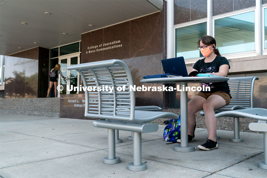 Freshman Journalism major Samantha Grove listens to a lecture through Zoom outside of Andersen Hall during the first day of in-person instruction at the University of Nebraska-Lincoln on Monday, August 24, 2020. Photo by Jordan Opp for University Communication.