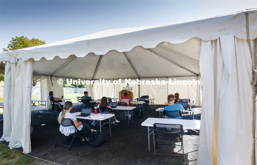 Law Professor Matt Schaefer teaches LAW 671 International Trade Law in a tent set up outdoors at the Law College. First day for in-person learning for the fall semester. August 24, 2020. Photo by Craig Chandler / University Communication.