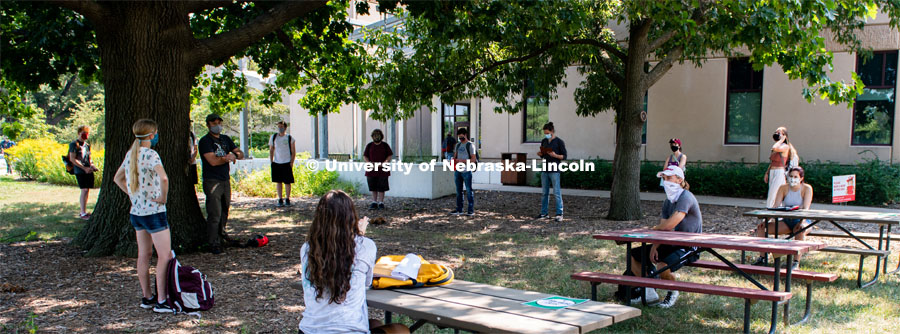 Students social distance and gather outside of Hardin Hall for the first day of in-person learning. Most years Professor Eric North teaches his Dendrology labs outside. August 24, 2020. Photo by Gregory Nathan / University Communication.