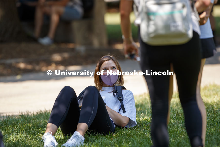 Annie Mimick talks with friends while she waits for her afternoon architecture class to begin. First day for in-person learning for the fall semester. August 24, 2020. Photo by Craig Chandler / University Communication.