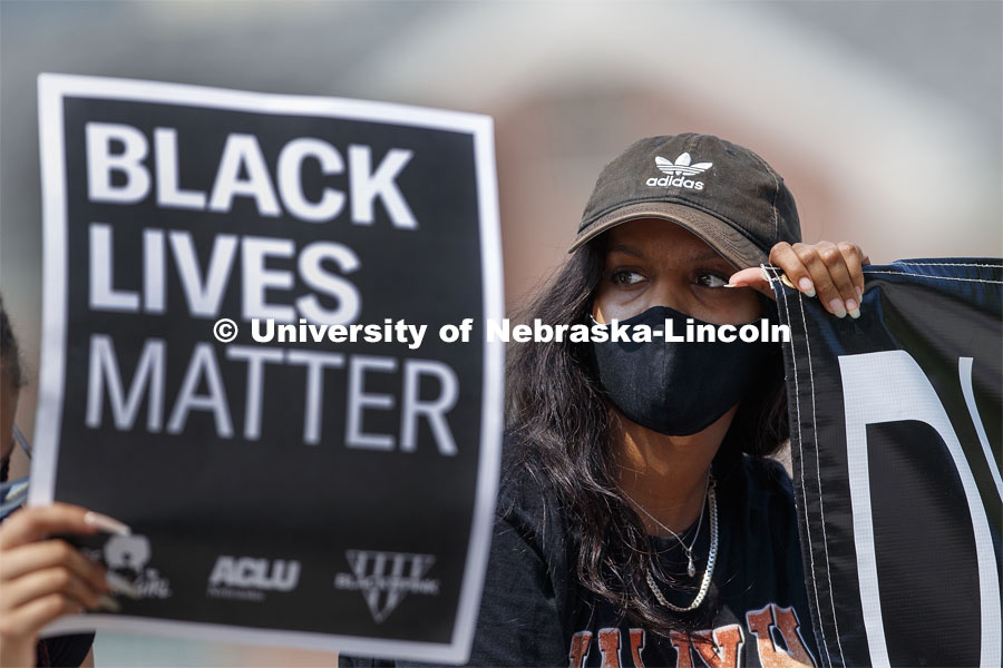 Batool Ibrahim holds one end of a Black Lives Matter banner at the sit-in sponsored by the Black Student Union to draw attention to the shooting of Jacob Blake in Kenosha, WI. August 25, 2020. Photo by Craig Chandler / University Communication.