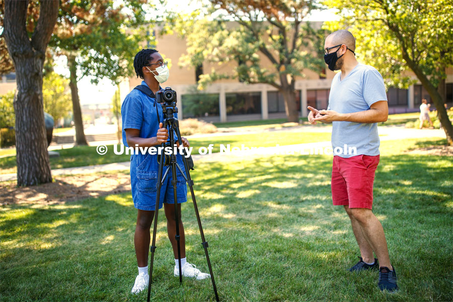 Walker Pickering explains camera settings to a student in the PHOT 161 - Photography for Non-majors class. City Campus. August 26, 2020. Photo by Craig Chandler / University Communication.