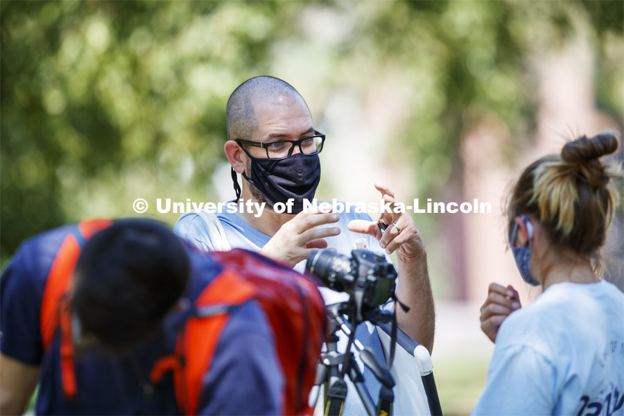 Walker Pickering explains camera settings to Lainey Ramaekers in the PHOT 161 - Photography for Non-majors class. City Campus. August 26, 2020. Photo by Craig Chandler / University Communication.