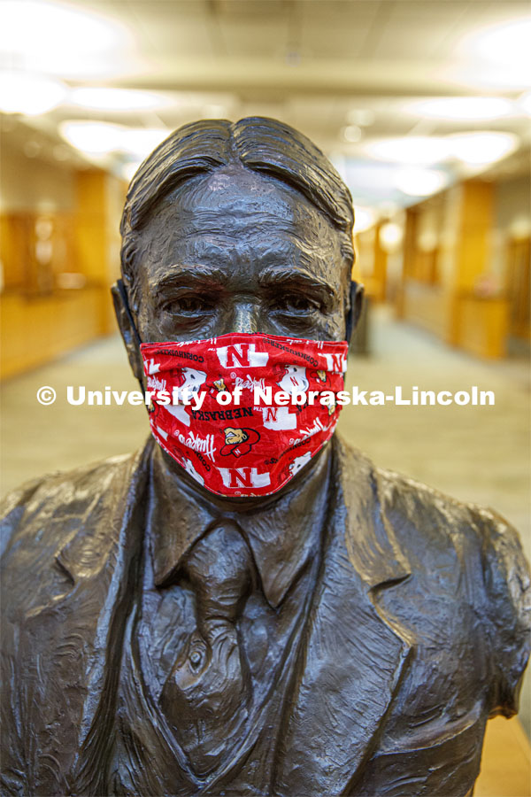 A masked Roscoe Pound bust sits in the entry of the Law Library. Law college photo shoot. September 3, 2020. Photo by Craig Chandler / University Communication.