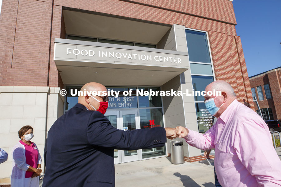 UNL Harlan Vice Chancellor for IANR and NU Vice President Mike Boehm, left, fist bumps United States Secretary of Agriculture Sonny Perdue at Purdue's arrival for the Nebraska Agricultural Innovation Panel. September 4, 2020. Photo by Craig Chandler / University Communication.