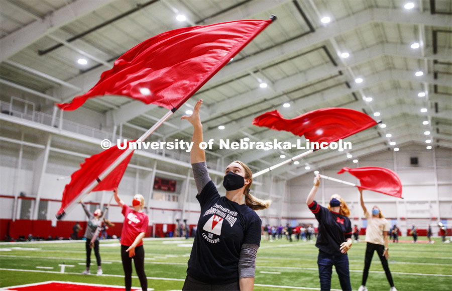 Michaela Smith and the flag team are out for an early morning spin as the Cornhusker Marching Band practices in Cook Pavilion. September 10, 2020. Photo by Craig Chandler / University Communication.