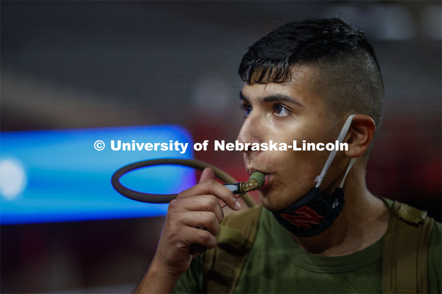 Roman Montes takes a drink from his Camelbak water pack. UNL ROTC cadets and Lincoln first responders run the steps of Memorial Stadium to honor those who died on September 11. Each cadet ran more than 2,000 steps. September 11, 2020. Photo by Craig Chandler / University Communication.