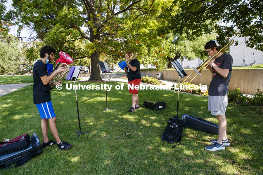 Max Jabir, freshman from Chicago, improvised a gritty choice for the glory of his music as he practices with two other musicians in the Sheldon Gardens. September 22, 2020. Photo by Craig Chandler / University Communication.