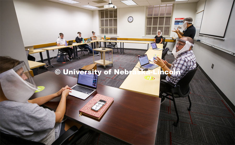 Jordan Soliz, sitting at right, teaches his Social Identity and Intergroup Communication course. All those in the class wear special face shields to aid a hearing-impaired student. September 23, 2020. Photo by Craig Chandler / University Communication.