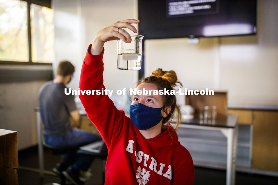 Raegan Hoyle, freshman from Fremont, Nebraska, checks her spinach leaf punches for her photosynthesis experiment. LIFE 120L - Fundamentals of Biology I laboratory. October 6, 2020. Photo by Craig Chandler / University Communication.