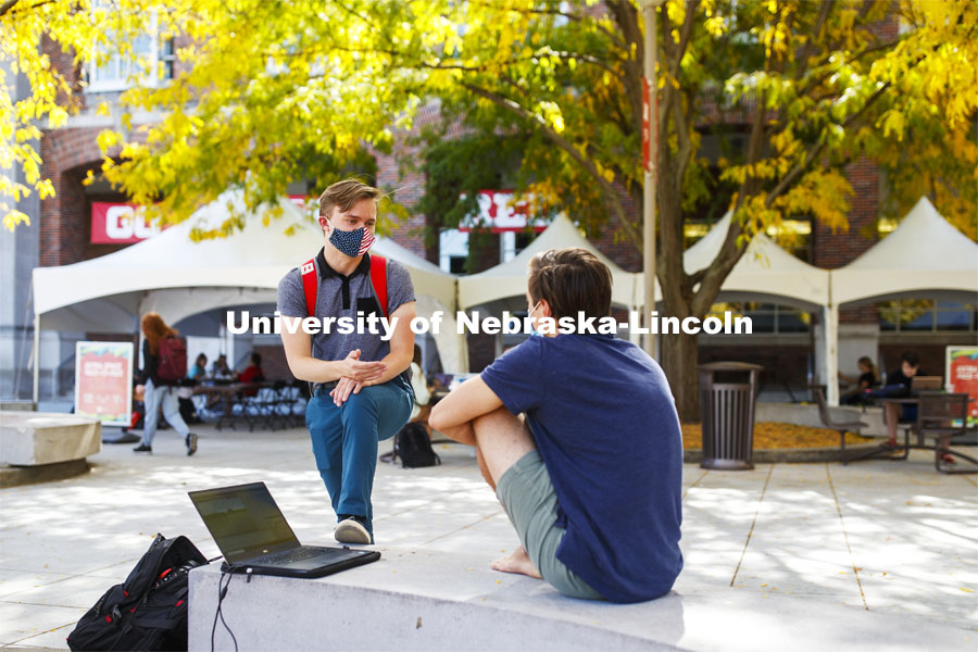 Ian Maltas, a junior from Lincoln, and Uri Harding, a junior from Omaha, talk during the noon hour outside the Nebraska Union. City Campus. October 7, 2020. Photo by Craig Chandler / University Communication.