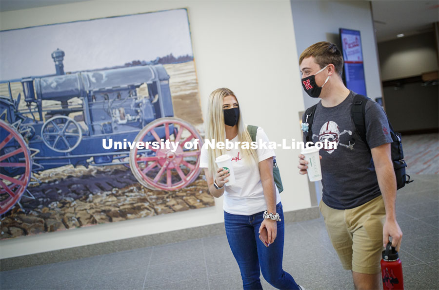 Students carrying their coffee as they cross throught the Union to get to class. Students inside the remodeled Nebraska East Union. East Campus photo shoot. October 13, 2020. Photo by Craig Chandler / University Communication.