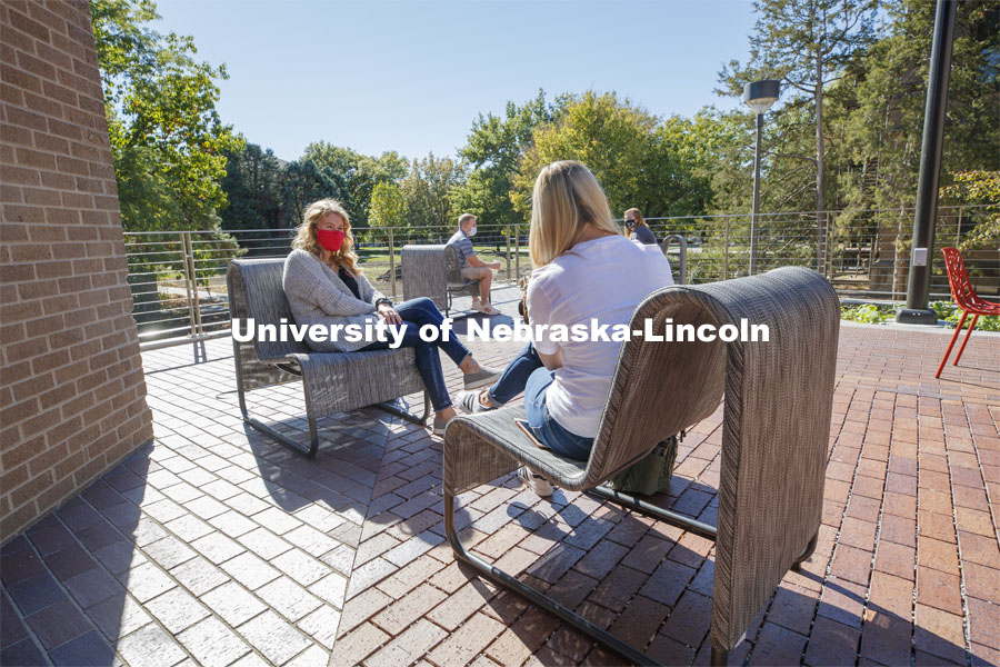 Students sit on the new patio along the south side of the Nebraska East Union. East Campus photo shoot. October 13, 2020. Photo by Craig Chandler / University Communication.