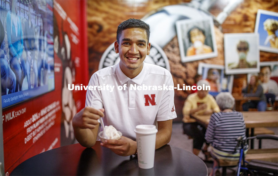 Students enjoy ice cream while social distancing inside the Dairy Store. East Campus photo shoot. October 13, 2020. Photo by Craig Chandler / University Communication.