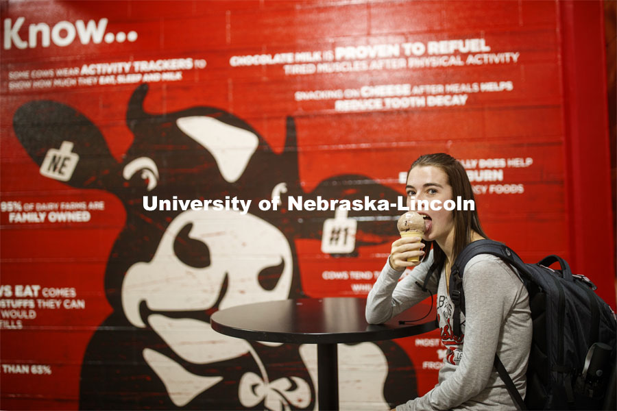 Students enjoy ice cream while social distancing inside the Dairy Store. East Campus photo shoot. October 13, 2020. Photo by Craig Chandler / University Communication.