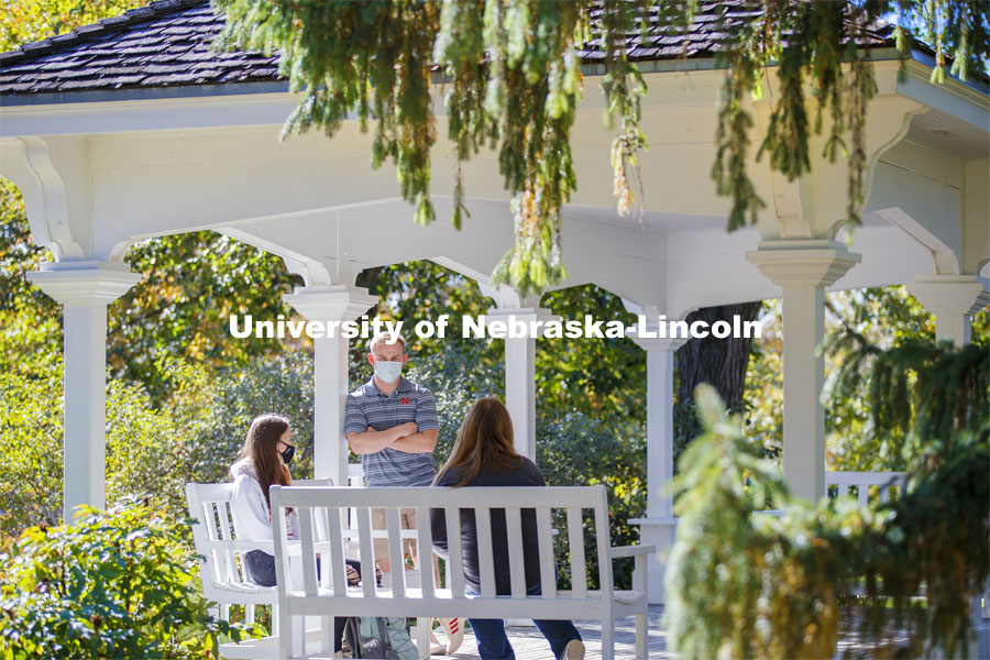 Students enjoy the afternoon on Perin Porch on east campus. East Campus photo shoot. October 13, 2020.  Photo by Craig Chandler / University Communication