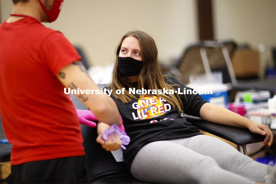 Kacey Heidbrink, a junior from Beatrice, listens to instructions while donating. Students donate in the Homecoming Blood Drive in the Nebraska Union ballroom on city campus. October 27, 2020. Photo by Craig Chandler / University Communication.
