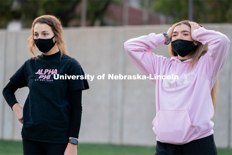 Kappa Kappa Gamma’s Liz Stacy (right) reacts to an errant throw during the ASUN Cornhole Competition at the Cather-Pound Greenspace on Wednesday, October 28, 2020, in Lincoln, Nebraska. Photo by Jordan Opp for University Communication.