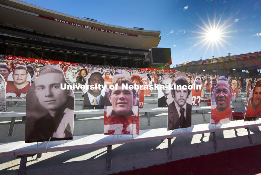 Nearly 100 Husker Academic All-Americans line the Memorial Stadium bleachers where the Cornhusker Marching Band normally plays (section 10) in the East Stadium. The university leads the nation with 340 student-athletes having earned Academic All-American status. More than 6,000 corrugated plastic cutouts fill the lower level of east stadium, the tunnel walk, and part of north stadium to remind the Huskers who has the Greatest Fans in College Football. November 12, 2020. Photo by Craig Chandler / University Communication.