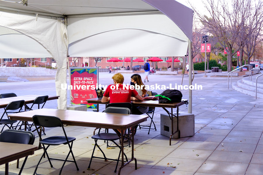 Students study outside of the Nebraska Union under the tents installed to help with social distancing. November 18, 2020. Photo by Daniela Chavez for University Communication.