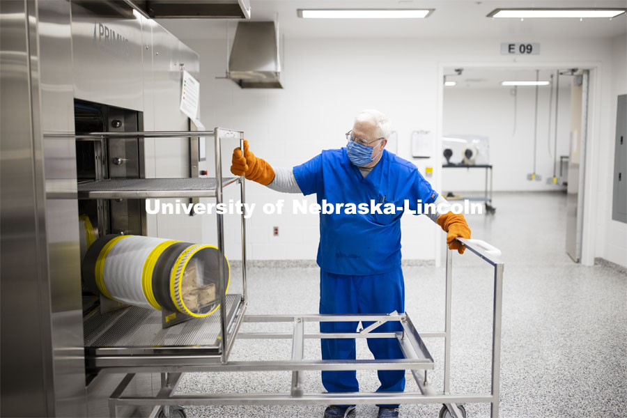 Robert Schmaltz, manager of the Gnotobiotic Mouse Facility, removes a sterilized supply cylinder from an autoclave. Photos of the new Gnotobiotic Mouse Facility - Nebraska Food for Health Center. November 19, 2020. Photo by Craig Chandler / University Communication.