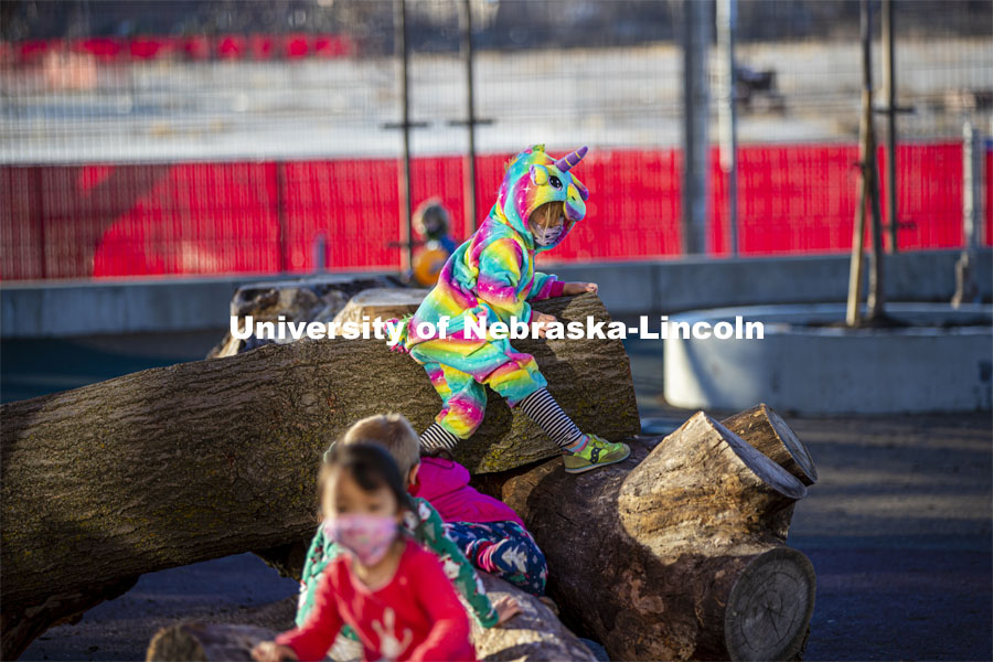 Children at the University of Nebraska-Lincoln Children's Center spent time on pajama day climbing on actual trees placed on the playground. December 7, 2020. Photo by Craig Chandler / University Communication.