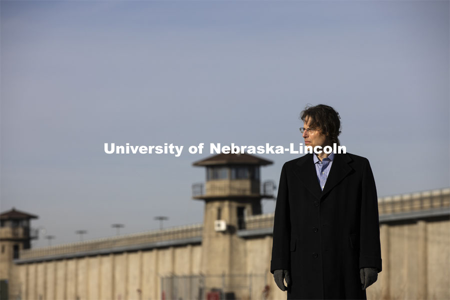 Eric Berger, Earl Dunlap Distinguished Professor of Law. His research focus is on death penalty law and he is shown outside of the Nebraska State Penitentiary. December 10, 2020. Photo by Craig Chandler / University Communication.